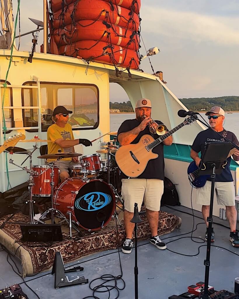 The Realm performing live music on Visit Montauk's annual 4th of July fireworks cruise aboard Viking