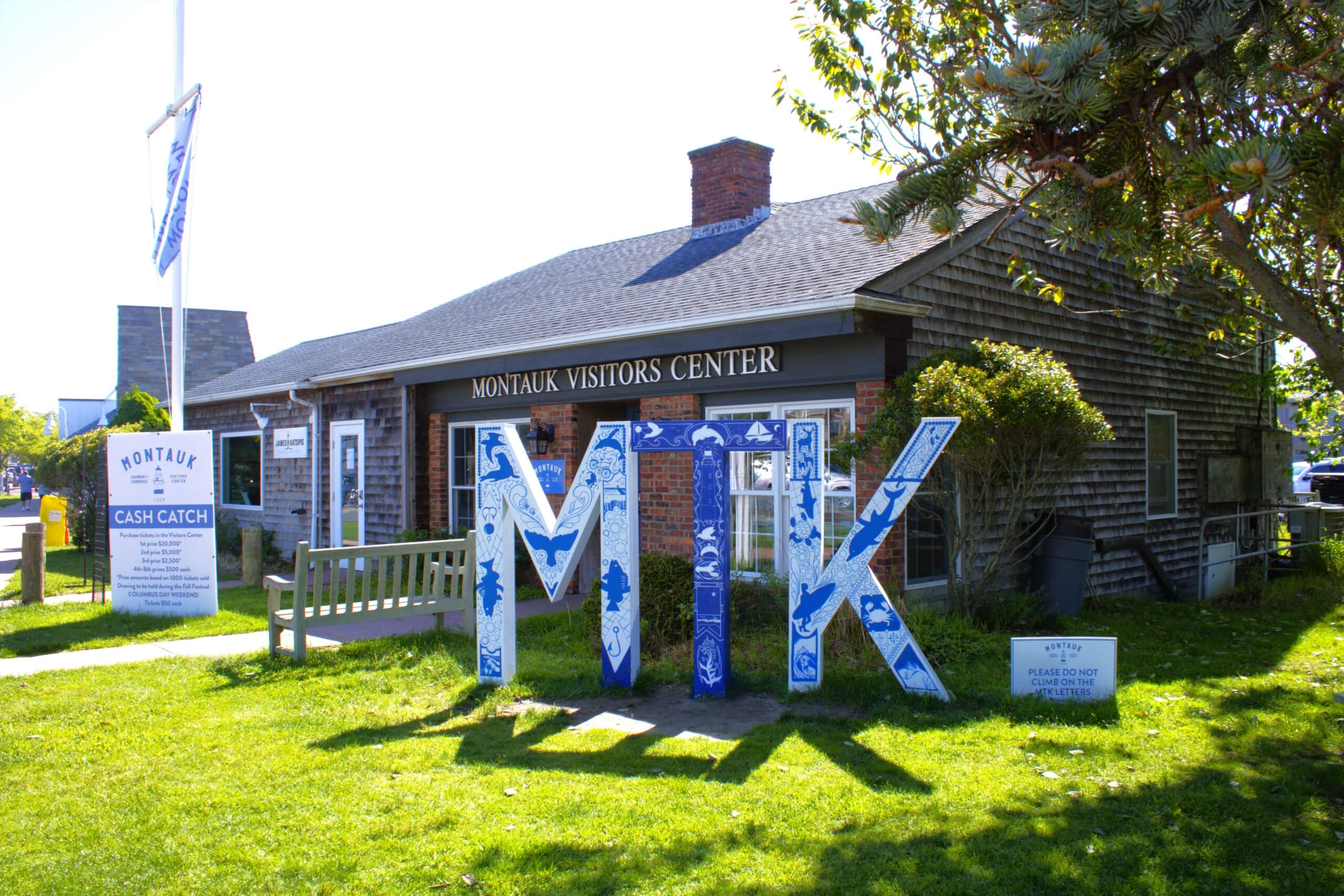 Montauk Chamber of Commerce and Visitors Center, Visit Montauk's "MTK" Letter Sign painted by Sarah Schreck, 2024
