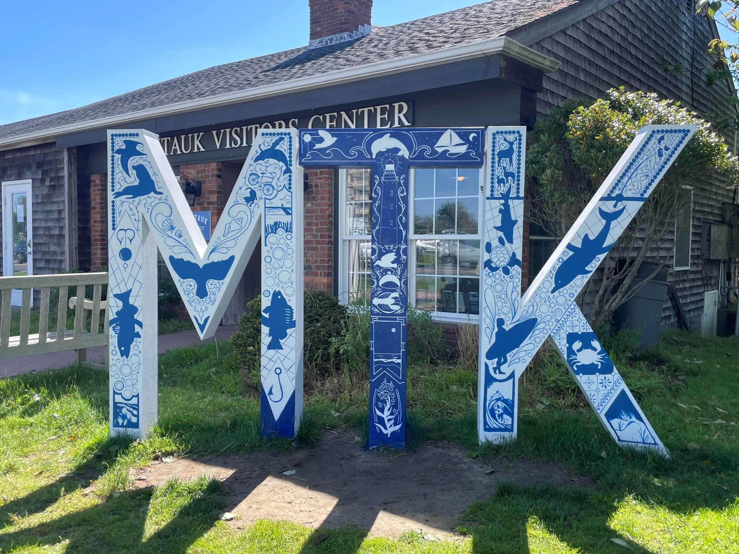 Montauk Chamber of Commerce and Visitors Center, Visit Montauk's "MTK" Letter Sign painted by Sarah Schreck, 2024