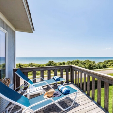 'image of blue lounge chairs on a balcony of a hotel room at Hartman's Briney Breezes in Montauk