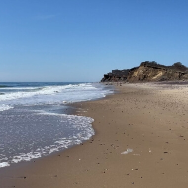 'Clear blue sky, empty beach at Ditch Plains Beach under the bluffs, Spring 2024