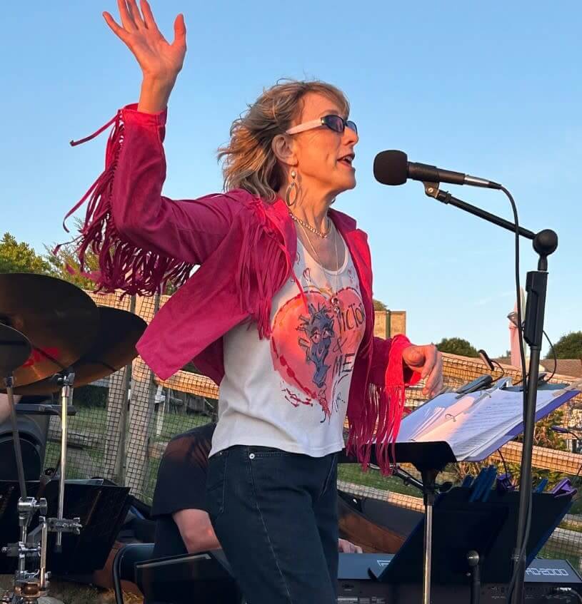 Sarah singing into the mic 