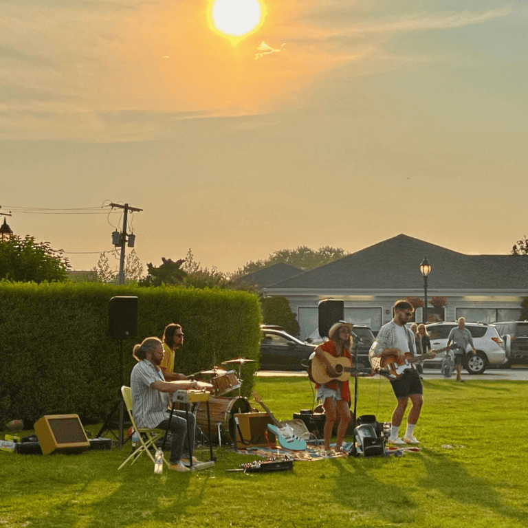 Annie Trezza playing on the green with her band