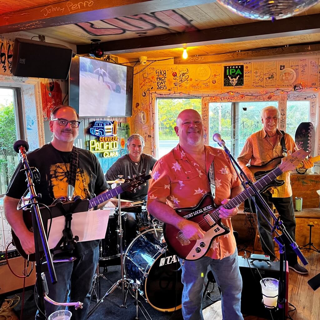 The dog watchers playing at Best Pizza