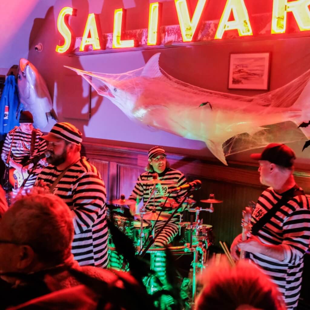 Salivars clam chowder house hosting the Realm Band dressed in inmate costumes for their annual halloween party.